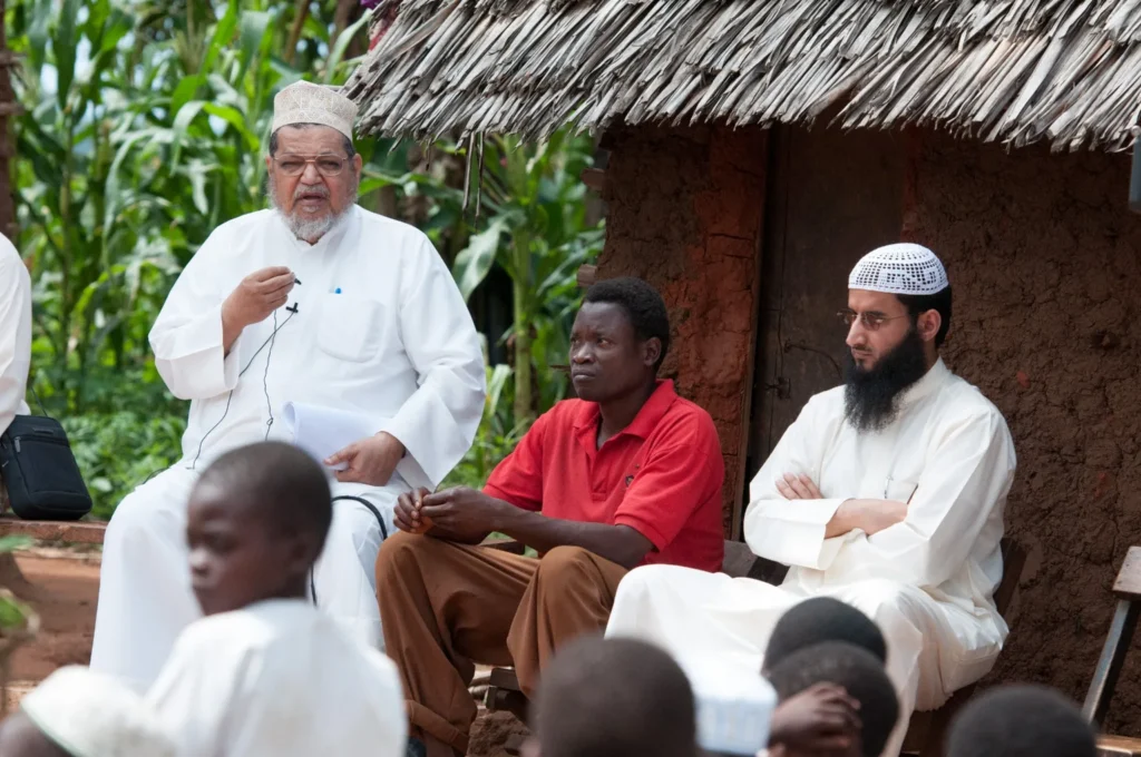 Dr. Al-Sumait outside a village home in Africa