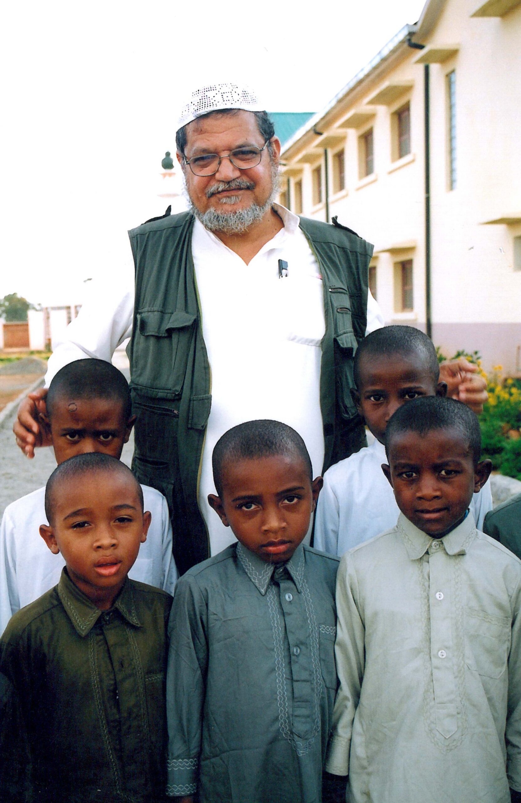 Dr. Abdulrahman Al-Sumait with children at an Africa Muslims Committee school
